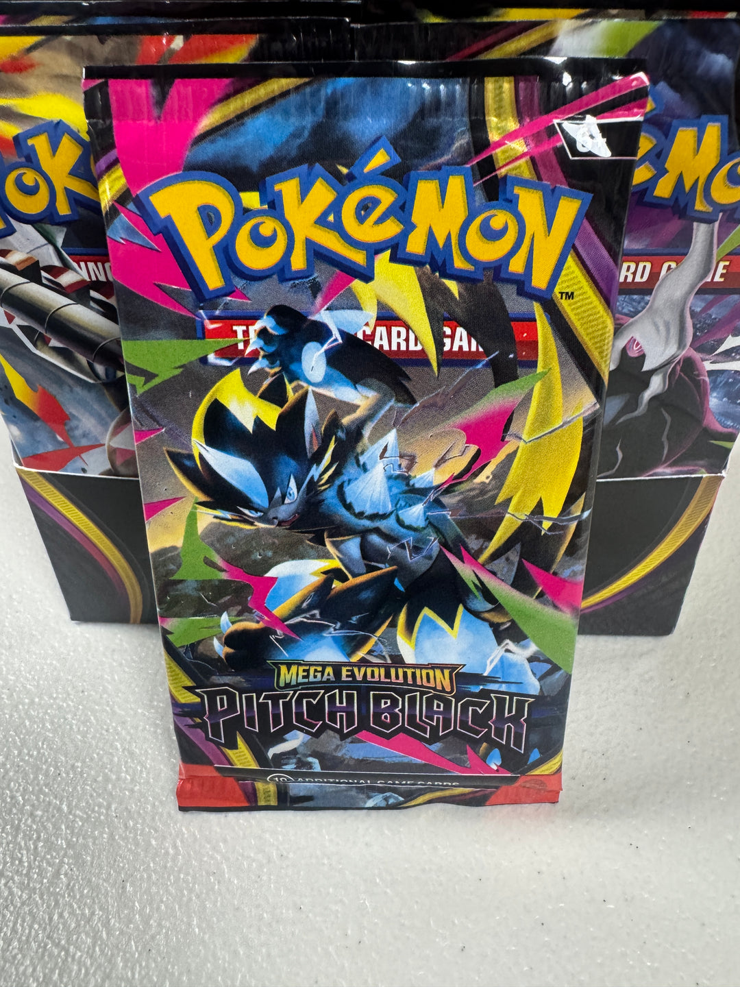 Pokemon TCG: Mega Evolution 05 Pitch Black- Booster Pack (5 Per Person, In Store Pick Up Only)
