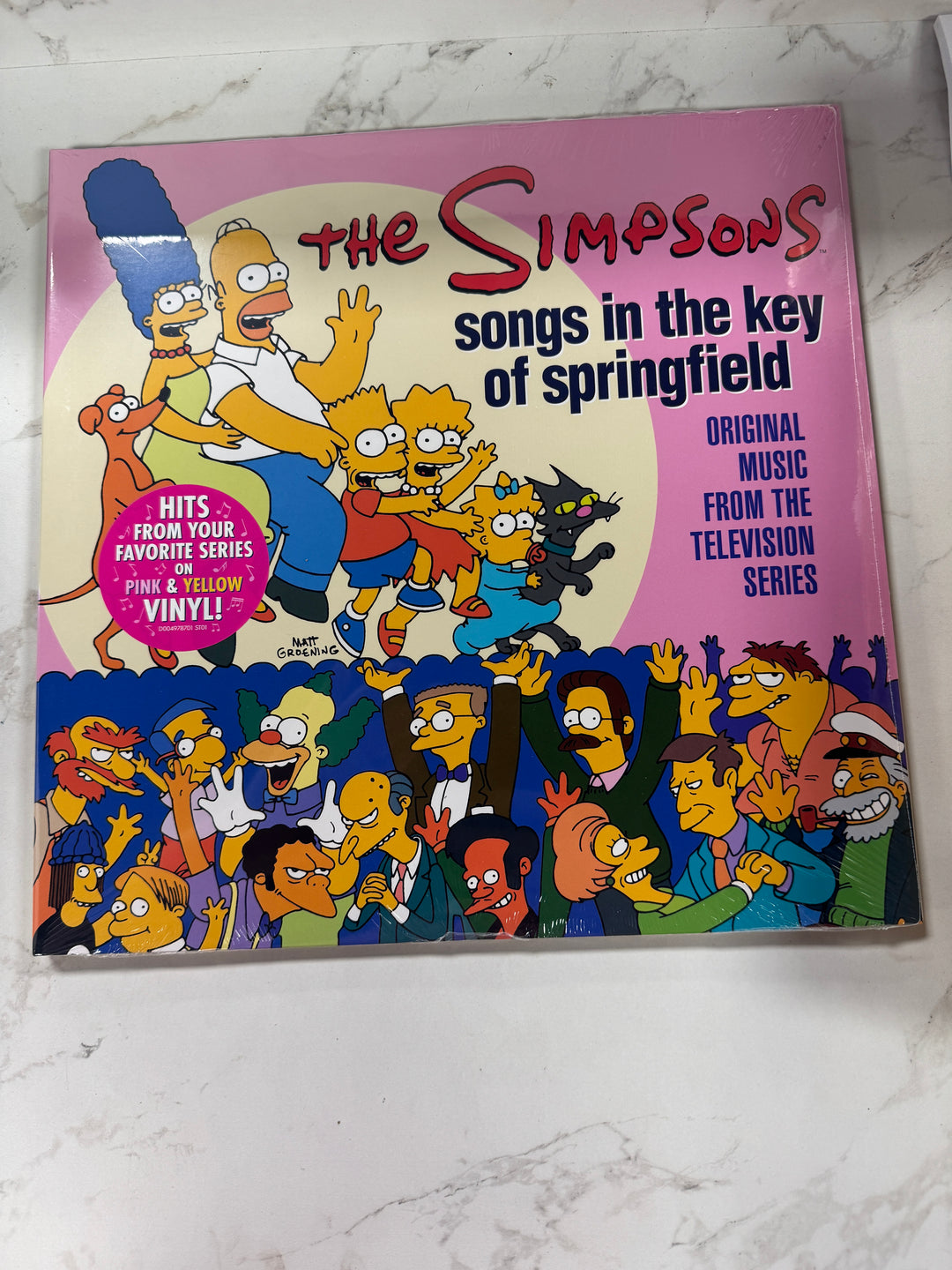 The Simpson's - Songs in the Key of Springfield (Original Music from the Television Series) Pink and Yellow Vinyl Record NR91426