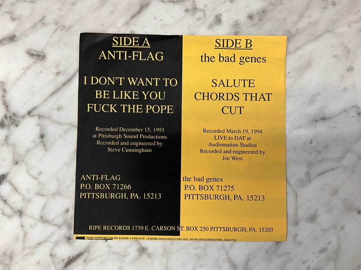 Anti-Flag / The Bad Genes - Rock’n With Father Mike (1994 Yellow Sleeve) Very Good VR101726