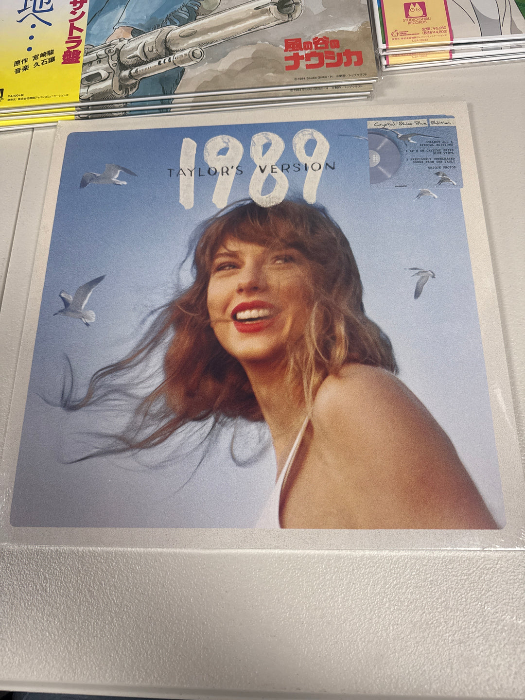 Taylor Swift - 1989 (Taylor's Version) [2LP] (Crystal Skies Blue Vinyl, 5 previously unreleased songs, gatefold with unique front & back cover art, sleeves feat. lyrics & photos for each version) NEW Vinyl Record NVR51926