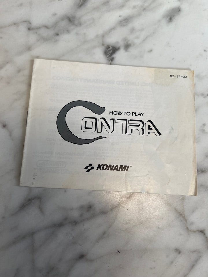 Contra NES Original Nintendo MANUAL ONLY Stains/Writing MO82625