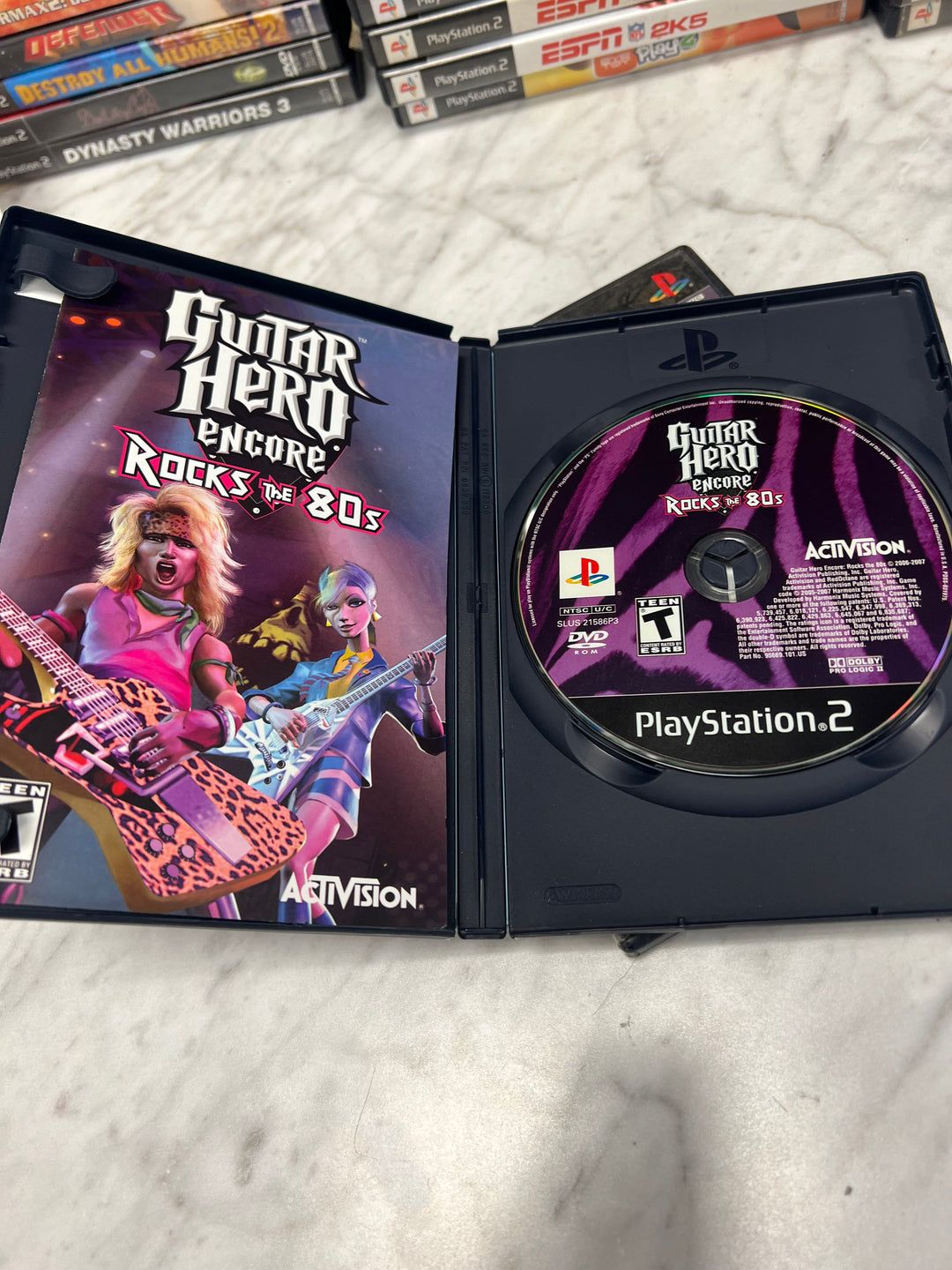 Guitar Hero Encore Rocks The 80's for Playstation 2 PS2 in case. Tested and Working.     DO62924