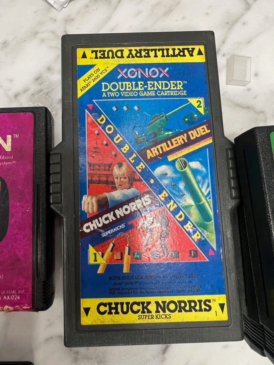 Xonox Double-Ender for Atari 2600. Chuck Norris and Artillery Duel