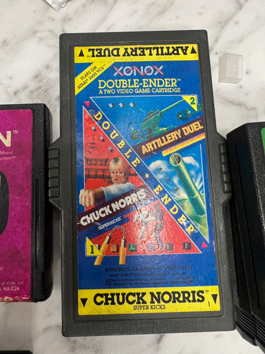Xonox Double-Ender for Atari 2600. Chuck Norris and Artillery Duel